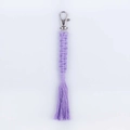 Handmade purple woven cotton tassel keychain with silver metal hook and clear texture - Light Purple
