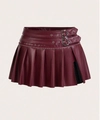 Detail of burgundy PU leather pleated skirt featuring side slit and double metal buckles - Fuschia
