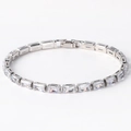 Silver-finish tennis bracelet featuring rectangular clear cubic zirconia on white background - White Zircon White Gold Plated