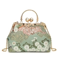 Elegant light green brocade handbag with chrysanthemum patterns and gold round handles - Green