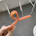 Detail of a peach pink twist hair claw clip with a strong gold metal spring mechanism - 13cm Hanger Type / Translucent Dark Orange