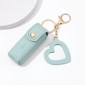 Light blue leather lipstick case keychain with golden snap and heart pendant accessory - Emerald
