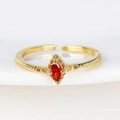 Detailed macro view of 18K gold plated twisted ring with red marquise zircon stone - Red Marquise Gemstone Gold Style (Style 3 Gold)