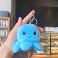 Cute reversible blue plush octopus keychain with a smiling face and metal keyring clip - Blue