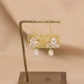 Vintage freshwater pearl earrings with gold wire weaving and white floral accents - Square Drop Earrings