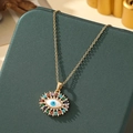 Detail of evil eye pendant with multicolored gemstones on a golden necklace - A8-Gold