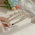 Double-layer pearl headband featuring delicate white flowers and golden accents - Pearl Style
