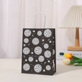 Black paper gift bag with white volleyball prints and sturdy twisted rope handles - Black Volleyball Silhouette