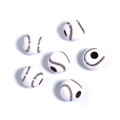 Macro view of white acrylic baseball beads with brown stitching for DIY jewelry making - White+Brown Baseball
