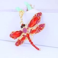 Golden dragonfly keychain with sparkling red crystals and pink rhinestones for bags - Red