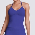 Close-up of seamless royal blue halter sports top with ribbed texture and front pleats - Indigo Blue