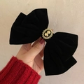 Elegant black velvet bow hair clip featuring a vintage gold relief portrait emblem - Black Velvet Vintage Cameo Clip