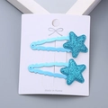 Glittery blue star hair clips for girls on a professional white display card - Blue Star Pair