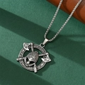 Detail of Viking skull pendant with crossed axes and runes on a silver box chain necklace - Double Axe Pendant