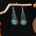 Detail of bohemian drop earrings with turquoise stones and blue rhinestones on wood - E5775-18/Double Teardrop Blue Rhinestone Turquoise