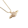 Bohemian gold Saturn star necklace with zircon stones on a white background - Star Saturn Style / Gold