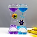 Close-up of heart-shaped liquid timer with blue and purple oil drops and spinning wheels - SY01 New Windmill Blue Purple