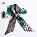 Dark green satin twilly scarf with chain and dot patterns tied in a bow - S06-Dark Green Polka Dot Chain