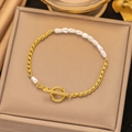 Baroque pearl and gold chain bracelet with OT toggle clasp on jewelry display - Gold Flat Pearl OT Buckle Bracelet