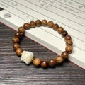 Rosewood bracelet with dark wood beads and white flower charm on vintage book - 8mm Awakening Lion Bracelet