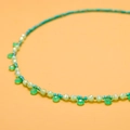 Detailed view of green natural stone beads and emerald semi-circular pendant on a necklace - GX03378B (Teal Beads with Round Pendant)