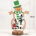 Wooden Christmas snowman ornament with Santa and reindeer scene on rustic base - Snowman Backpack Santa Claus Style