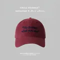 Classic deep red cotton baseball cap featuring navy blue embroidered text and curved brim - One Size(Adjustable) / Burgundy