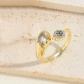 Zircon flower ring in 14K gold finish featuring blue and clear micro-pave crystals - Royal Blue Zirconia Ring (JZ0349-1)