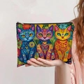 Handheld view of bohemian canvas pouch featuring vibrant artistic cat patterns and zipper - Three Bohemian Cats (jiaying001)