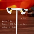 Detailed view of 304 stainless steel geometric earrings with 14K gold enamel finish - Black White Gold Irregular Splicing Style (EH8480) / Black/White/Gold