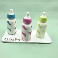 Three-piece slow rebound baby bottle squishy toys in blue pink and green cow print - Baby Bottle