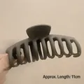 Matte dark grey 11cm hair claw clip for thick hair shown in a hand-held detail view - Matte Dragon Bone Coffee-11cm