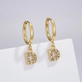 Gold-finished letter D earrings featuring pavé white zircons on a minimal display - Letter D (Style: 0229)