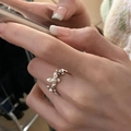Minimalist silver ring with floral design and pearl accent worn on finger - Pearl Flower Design Ring (J2923)