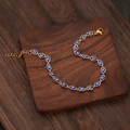 Bracciale occhio di Allah dorato con perline blu e chiusura a moschettone regolabile - Blu