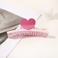 Detailed view of sweet pink heart-shaped hair claw clip on a minimalist white desk - Heart Straight / Light Pink