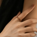 Detail of minimalist open heart-shaped ring in gold finish on a model hand - Adjustable Open / Red (KR0037-1)