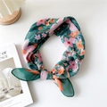 Green floral cotton linen scarf with soft pink flowers in a knot style display - 20 Cotton - Xanthoceras Green