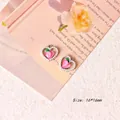 Detail shot of heart-shaped peach charm with pink enamel, faux pearls and 16x16mm dimensions - Style 10 Pearl Peach Heart