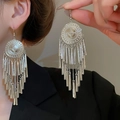 Detailed view of large silver boho tassel earrings featuring intricate engraved round discs - 59# Hook-Silver