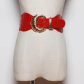Detail of a wide red crocodile pattern belt with a large golden buckle on a mannequin - 60-80cm / Red