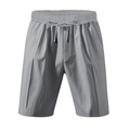 Detalle de los pantalones cortos de lino gris con cintura elástica y textura de bolsillos - Gris claro