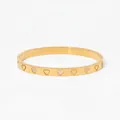 Gold-tone stainless steel bangle featuring openwork heart motifs and zircon accents - Gold Heart Inlaid Zirconia Style (KD1250)