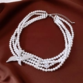 Detail of multi-layer pearl necklace with eagle pendant on red silk background - White (27# Necklace)