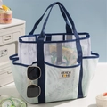 White mesh beach tote with dark blue straps and multiple pockets for travel storage - Light Green