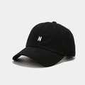 Close-up of high-quality white N letter embroidery on a black cotton twill baseball cap - Adjustable / Black