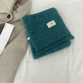 Soft wool blend knit scarf in deep teal blue featuring a minimalist egg logo label - egg Series / Teal