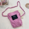 Pink corduroy crossbody bag with drawstring design and black square letter label - Pink (Corduroy Strap)