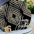 Macro shot of gold acrylic 16th Happy Birthday cake toppers with black and gold patterns - Design No.3 / Silver