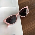 Chic pink cat eye sunglasses with dark lenses on a vintage fashion magazine background - Pink Frame Dark Grey Lens